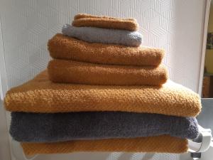 a stack of towels stacked on top of each other at ferme des champs in Vrécourt
