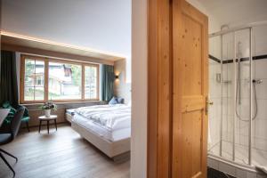 Postel nebo postele na pokoji v ubytování Posthotel Valbella