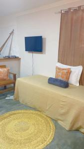 Un pat sau paturi într-o cameră la Pousada Monte das Serras