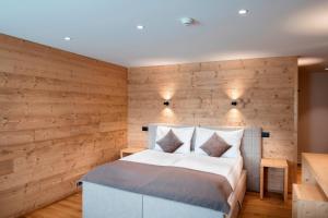 Postel nebo postele na pokoji v ubytování Posthotel Valbella