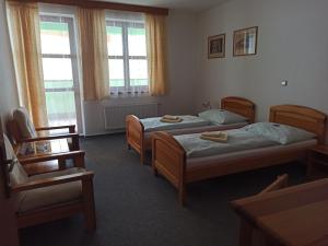 Posteľ alebo postele v izbe v ubytovaní Penzion Stella