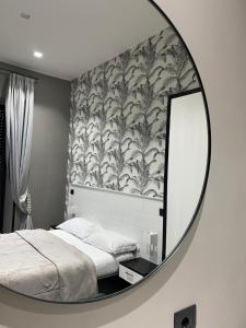 Łóżko lub łóżka w pokoju w obiekcie Parthenope Rooms