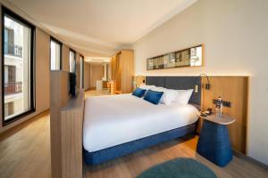 Tempat tidur dalam kamar di Ocean Drive Madrid