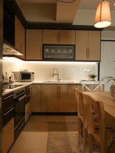 A cozinha ou cozinha compacta de Beach House in Itea-Delphi