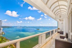 a balcony with a view of the ocean at Cozy Oceanview Retreat on the Bay in Miami