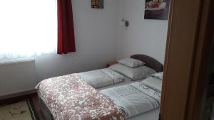 Voodi või voodid majutusasutuse Orchidea Apartman toas
