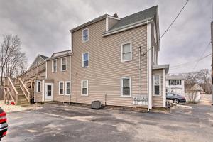 a house with a car parked in front of it at Cozy Third-Story Apartment in Dtwn Brockton! in Brockton