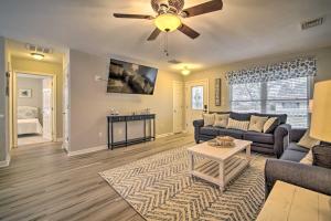 a living room with a couch and a ceiling fan at Charming Somers Point House with Private Pool! in Somers Point