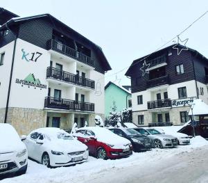 a group of cars parked in front of a building at Zlatiborski konaci k17 i K19 in Zlatibor