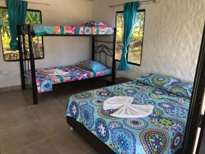 Postel nebo postele na pokoji v ubytování Cabañas Villa Juanes + 121 fotografií