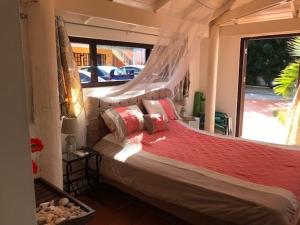 Llit o llits en una habitació de Flamingo Sunsets Apartment