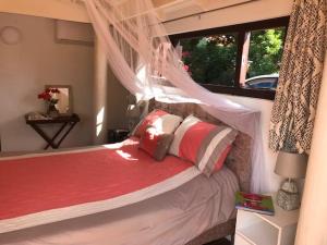 Katil atau katil-katil dalam bilik di Flamingo Sunsets Apartment