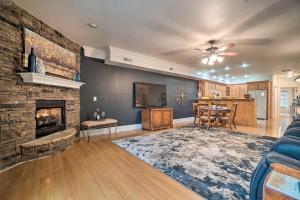 a living room with a fireplace and a tv at Cozy Young Harris Condo Near Lake Chatuge! in Young Harris