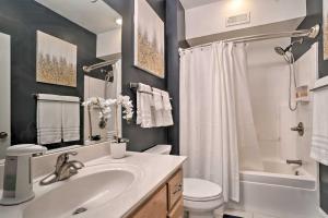 a bathroom with a sink and a toilet and a shower at Cozy Young Harris Condo Near Lake Chatuge! in Young Harris +26 photos