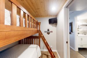 a bedroom with a wooden staircase in a house at West Lake Lodge 309 in Copper Mountain
