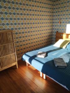 Ένα ή περισσότερα κρεβάτια σε δωμάτιο στο Gîte Moishan