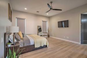 a bedroom with a bed and a ceiling fan at Sedona Sanctuary with Hot Tub, Fire Pit and Grill in Sedona
