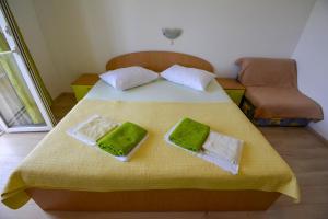 Postel nebo postele na pokoji v ubytování Apartmani Zlata