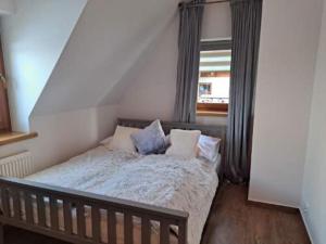 Postel nebo postele na pokoji v ubytování Hawrań