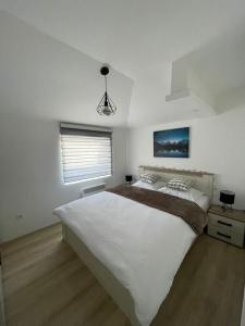 Postel nebo postele na pokoji v ubytování Apartman Mateo Zlatar