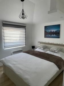 Postel nebo postele na pokoji v ubytování Apartman Mateo Zlatar