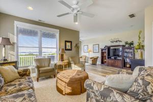 a living room with couches and a tv at 13009 Bowline Ln 1 in Ocean City