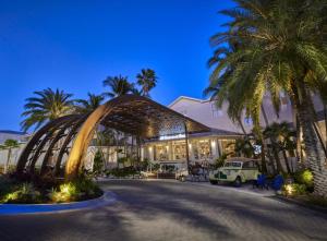 a building with palm trees in front of it at Margaritaville Beach House Key West in Key West