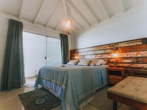 Cama ou camas em um quarto em Pousada Dora