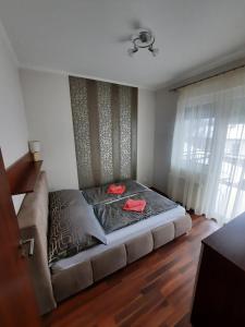 Posteľ alebo postele v izbe v ubytovaní Wellness Apartman