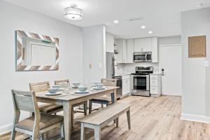 a kitchen and dining room with a table and chairs at Fiddlers Cove 19E in Hilton Head Island
