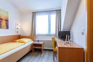 Postel nebo postele na pokoji v ubytování Pension Haus Weierts