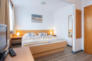 Postel nebo postele na pokoji v ubytování Pension Haus Weierts + 9 fotografií