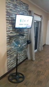 a fan sitting in front of a brick wall at Apartamento Armonía 01 in Punta Colorada +7 photos