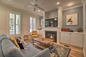 a living room with a couch and a fireplace at Charming Beaufort Home, Bike to Historic Dtwn in Beaufort