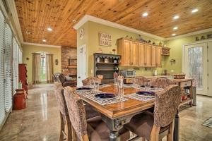 a large kitchen with a wooden table and chairs at Dog-Friendly Family Home Steps to Norris Lake in Maynardville