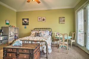 a bedroom with a bed and a table and a tableablish at Dog-Friendly Family Home Steps to Norris Lake in Maynardville