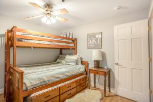 a bedroom with a bunk bed and a ceiling fan at Vail Dreams in Vail