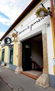 a building with a garage with a black door at Mathias Rex in Szentendre