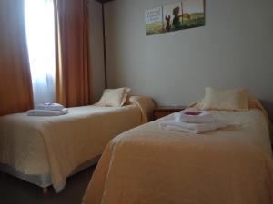 Cama ou camas em um quarto em Cabañas Oyikil