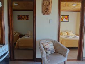 Tempat tidur dalam kamar di Cabañas Oyikil