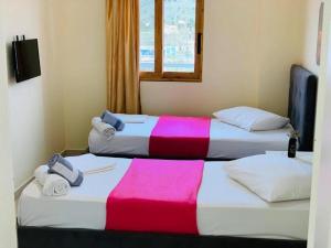 Postel nebo postele na pokoji v ubytování Mintt Hotel