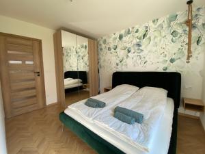 Voodi või voodid majutusasutuse Apartament Baltic Premium Garden z ogródkiem toas