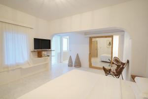 A bed or beds in a room at New Villa Komos in Pitsidia,Matala,Crete