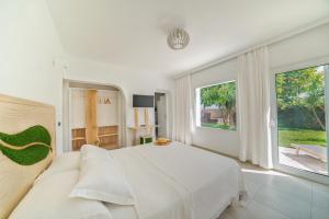 A bed or beds in a room at New Villa Komos in Pitsidia,Matala,Crete
