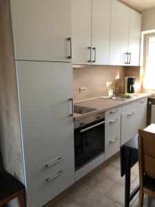 Kuchyň nebo kuchyňský kout v ubytování Haus Annegrete mit überdachter Terrasse zum Garten