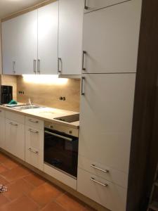 Kuchyň nebo kuchyňský kout v ubytování Haus Annegrete mit überdachter Terrasse zum Garten