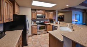 A kitchen or kitchenette at Spacious & Cozy Condo With Wood Fireplace condo