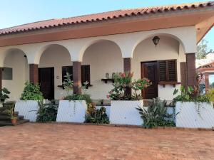 a house with a lot of plants in front of it at PolanaHibiscosLodge&Spa in Maputo