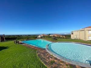 an overhead view of a swimming pool in a yard at Goose Valley Unit EE4 in Plettenberg Bay