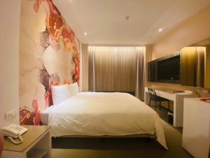  Una cama o camas en una habitación de Artinn Hotel 